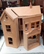 A part built dolls house with few items of furniture COLLECT ONLY