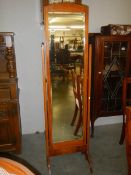 A mid 20th century oak cheval mirror. COLLECT ONLY.