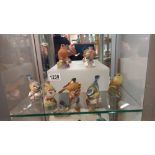 Seven Royal Worcester bird figures.