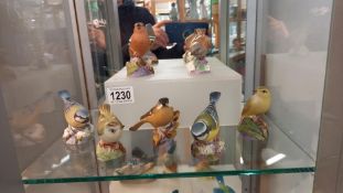 Seven Royal Worcester bird figures.