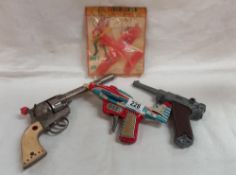 A tinplate Nomura Mustang aeroplane spark gun a/f and diecast cap guns etc