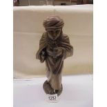 A carved wood figure of a boy (30cm tall)
