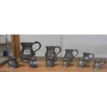 Ten Georgian/Victorian pewter tankards/measures.