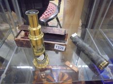 A brass microscope and a telescope