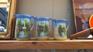A set of 3 graduated vintage pottery jugs