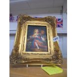 A gilt framed study of a child with a dog signed R Wilson.