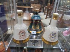 Three Wade Whisky Bell - Births of Princes William and Harry plus one other, with some contents.