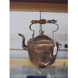 A Victorian oval copper kettle.