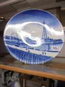 A large early 20th century blue and white wall plate featuring Blackpool fron North Pier, 31 cm dia.