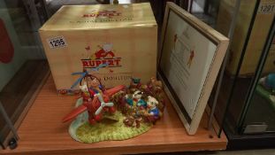 A boxed Royal Doulton Rupert figure "Rupert Takes a Flying Lesson."