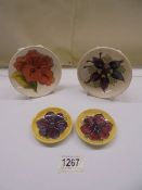 Four Moorcroft pin dishes.