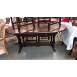 A dark oak oval dining table COLLECT ONLY