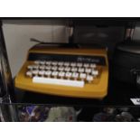 A cased Petite typewriter