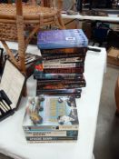 A quantity of Bernard Cornwell military novels (hard & paperbacks) & a quantity of true story war