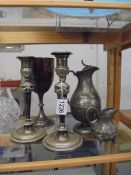 A pair of silver plate candlesticks and other silver plate items.