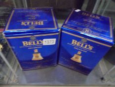 Two boxed Wade Bells whisky decanters with contents.