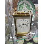 A brass carriage clock, springs ok but would benefit from a clean.
