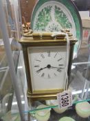 A brass carriage clock, springs ok but would benefit from a clean.