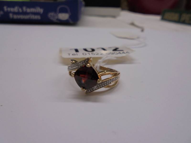 A 9ct gold ruby and diamond ring, size M, 2.9 grams.