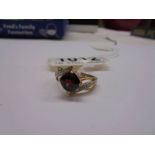 A 9ct gold ruby and diamond ring, size M, 2.9 grams.