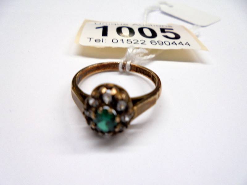 A yellow gold emerald and CZ ring, size O half, 2.8 grams.