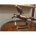 A patinated brass figure of a rearing horse height 31cm