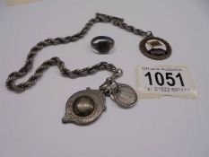 A silver watch Albert with a silver fob together with a silver ring, 30.62 grams (1 ounce).
