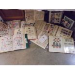 A collection of twelve stamp albums including UK, World, USA etc.,
