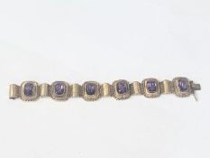 An 14ct gold (585) bracelet set six large amethyst stones, total weight 42.39 grams.