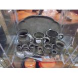 A pewter tray and a quantity of pewter tankards etc.,