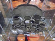 A pewter tray and a quantity of pewter tankards etc.,