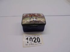 An 18thC enamel snuff box with a wrestling scene on lid, crack on base & a few nicks inside lid.