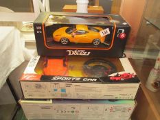 2 remote control sports cars and one other