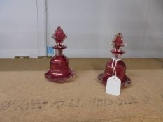 Two Victorian cranberry glass scent bottles.