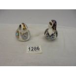 Two small Royal Crown Derby duck paperweights with stoppers.