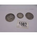 An 1801 George IIII silver coin, an 1821 George IIII silver coin and a Victoria silver florin.