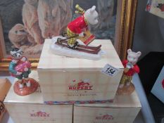 A boxed Royal Doulton Rupert figure "Tempted to Trespass" and a boxed Rupert money box