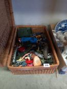 A large basket of vintage toys, mainly plastic soldiers including cowboys etc. COLLECT ONLY