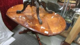 An oval inlaid coffee table, COLLECT ONLY.