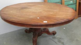 A Victorian mahogany oval tip top table, COLLECT ONLY.