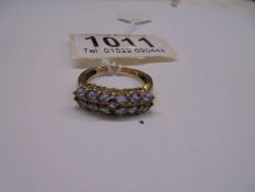 A yellow gold ring set tanzanites, size P, 2.8 grams. Marked 375