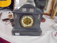 A slate clock, in working order but no key. COLLECT ONLY.