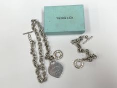 A boxed Tiffany silver pendant on Tiffany chain and another Tiffany Chain