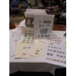A box containing a large quantity of mini collections of stamps from many countries of the world,