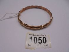 A 9ct gold bangle, 9.69 grams. (inside diameter approximately 8 cm).