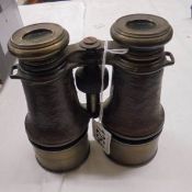 A pair of 19th century brass & leather Le Petit Fab, Paris binoculars.