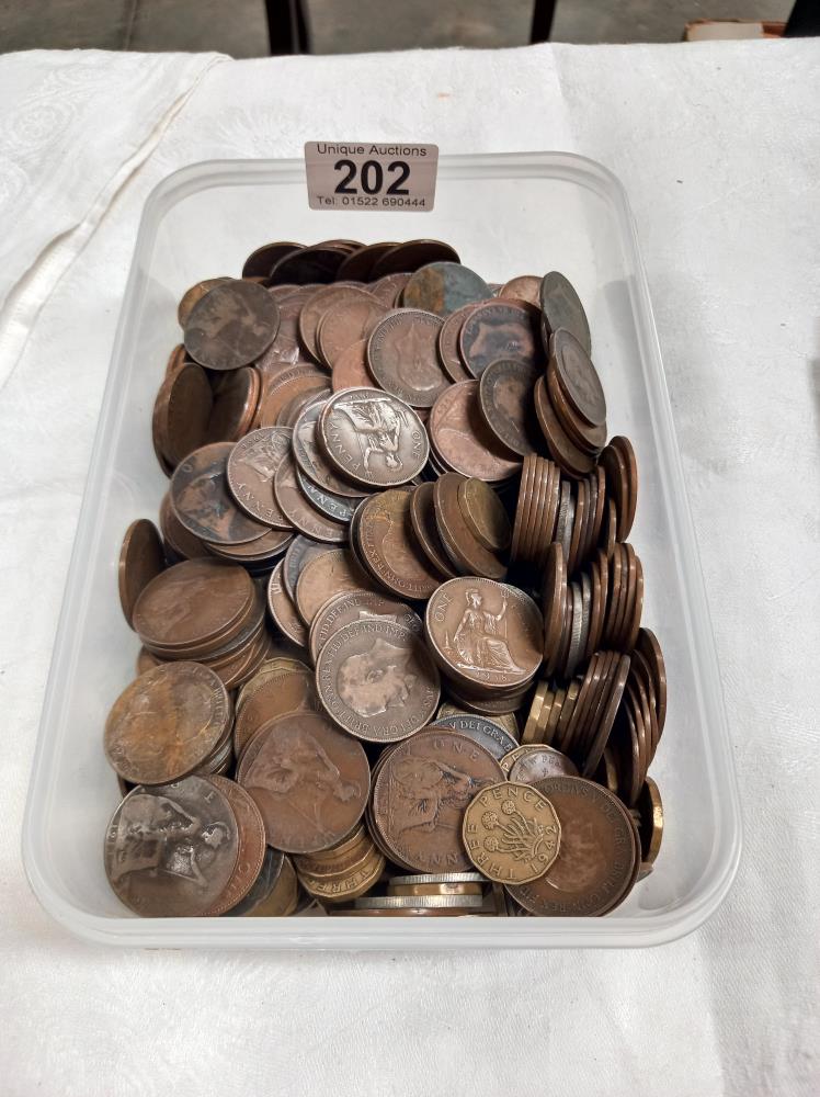 A tub of old UK copper coins