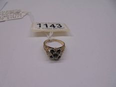 A 9ct gold diamond and sapphire ring with textured shoulders, dated London 1975, size M half, 4 g.