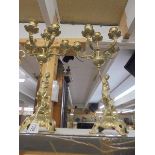 A pair of brass figural candelabra.