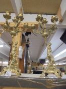 A pair of brass figural candelabra.